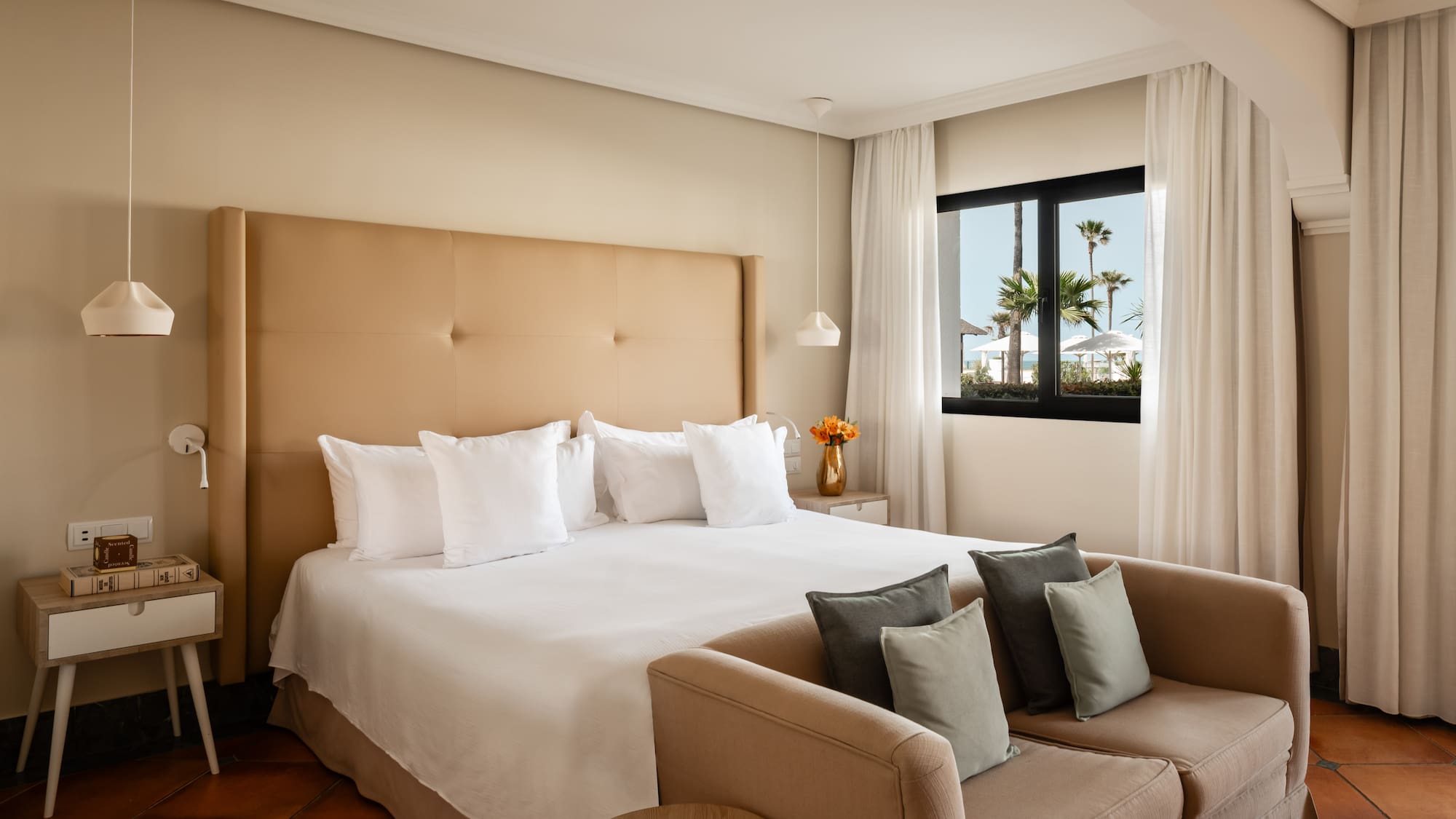 a bed with pillows in a room