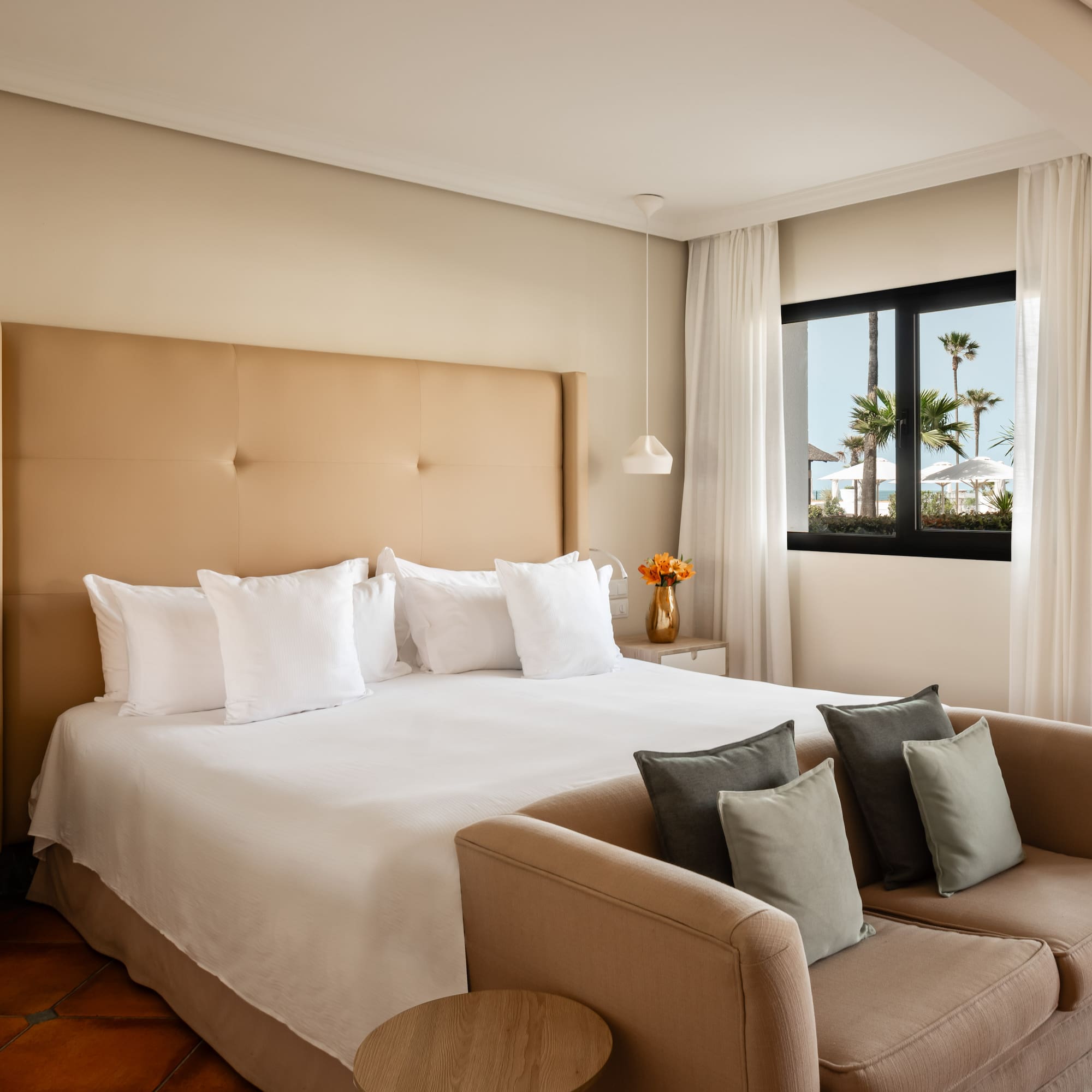 a bed with pillows in a room