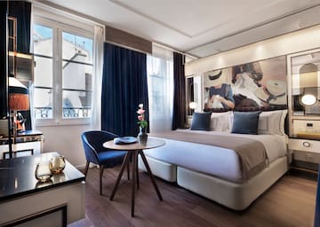 a bedroom with a bed and a table