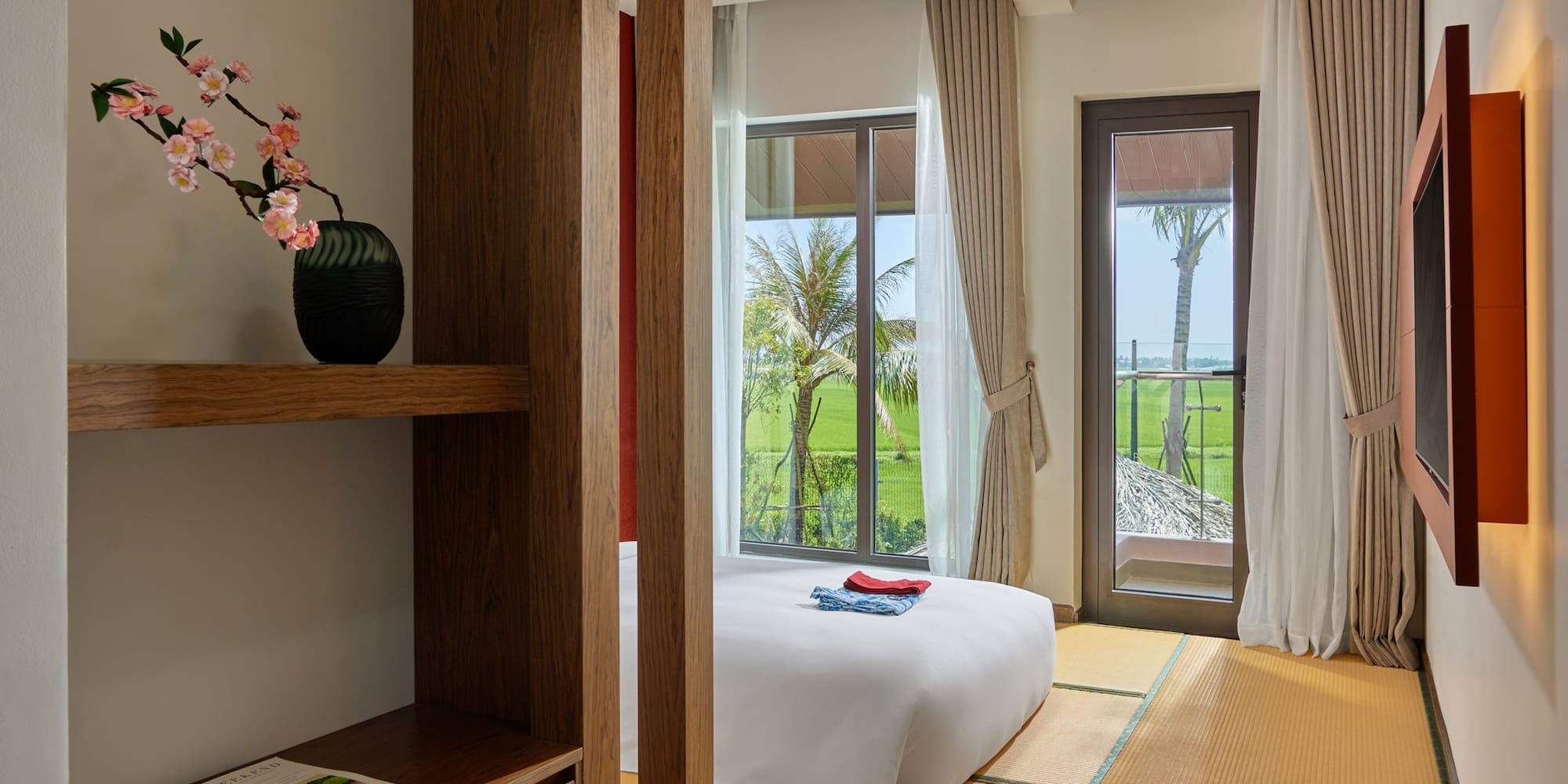 a room with a bed and a bookcase