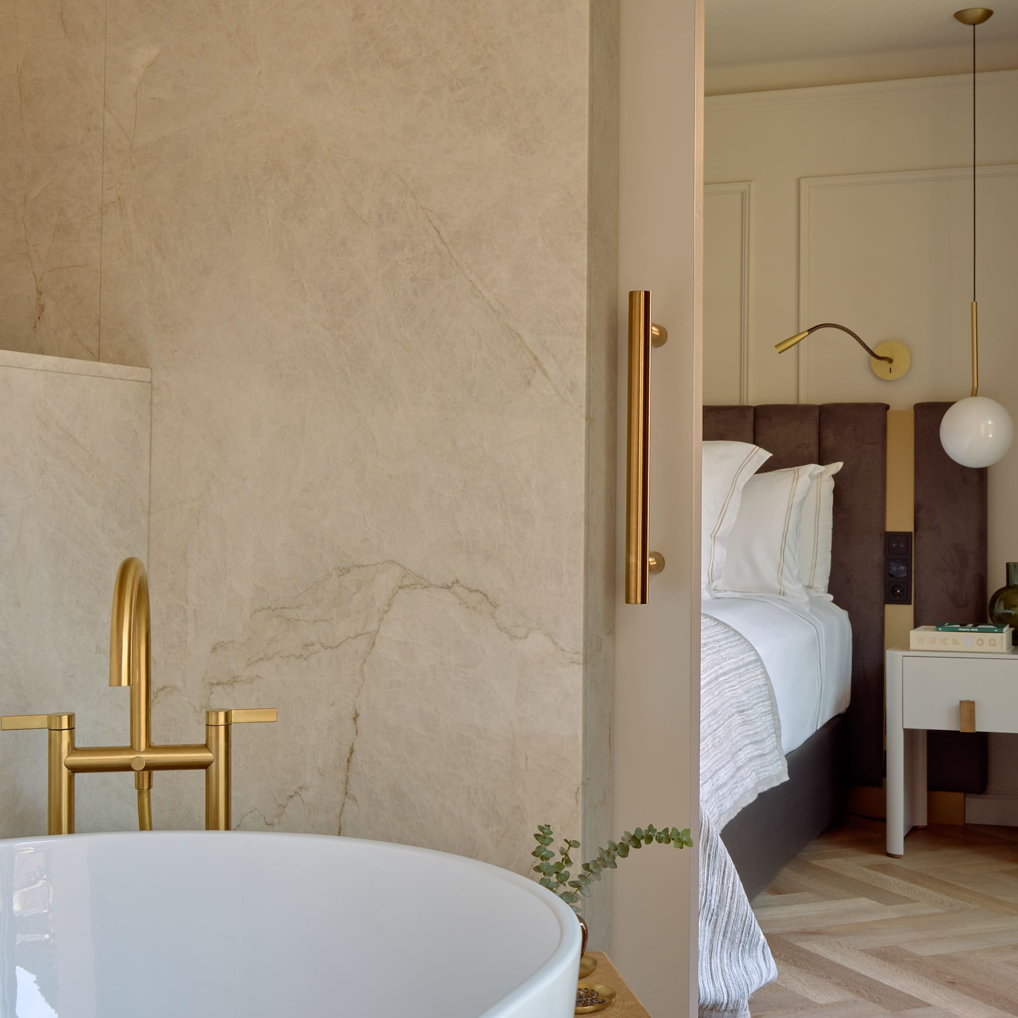 a bathroom with a bathtub and a bed