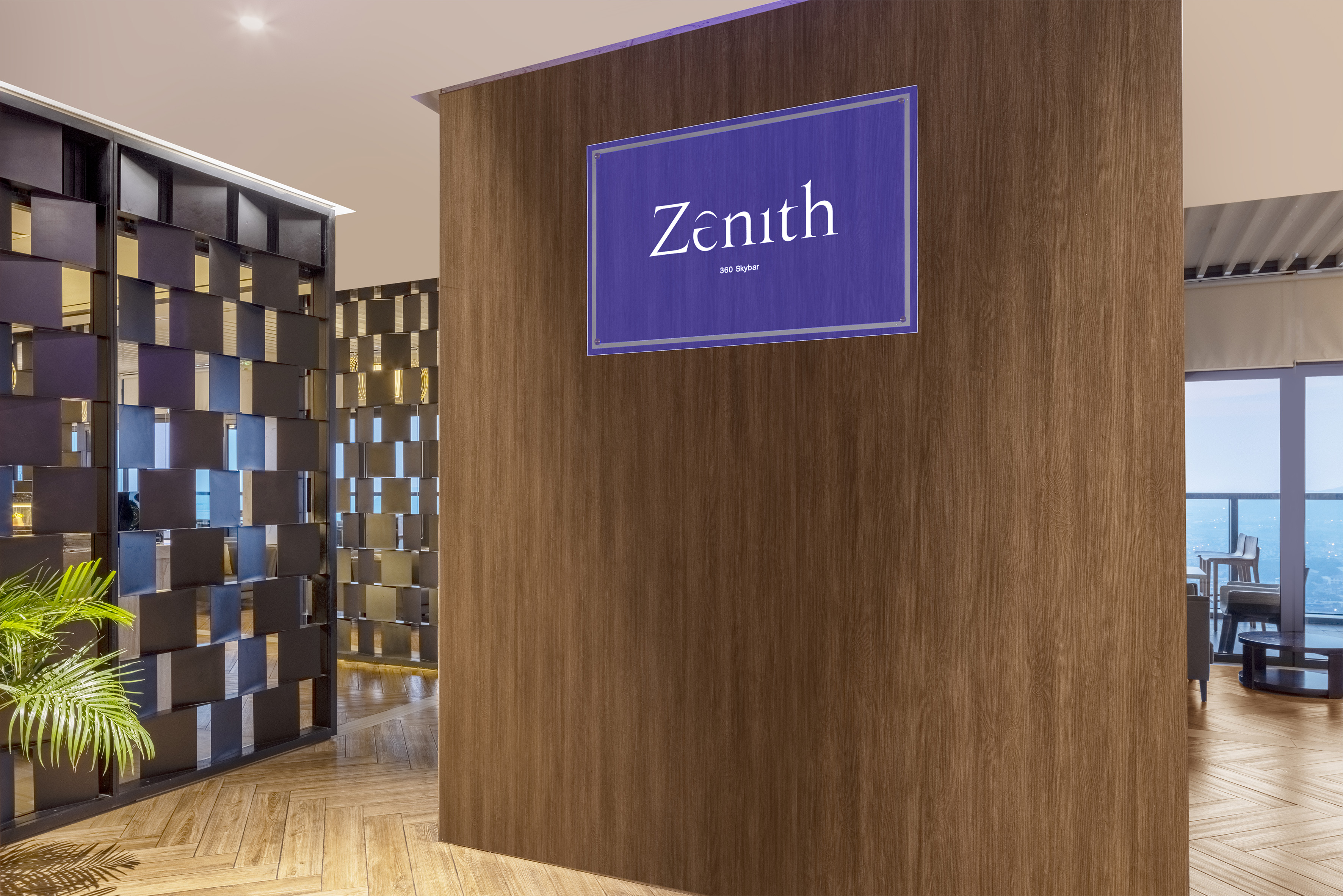 Zenith 360 Skybar sign on a wooden wall, modern hotel lobby entrance.