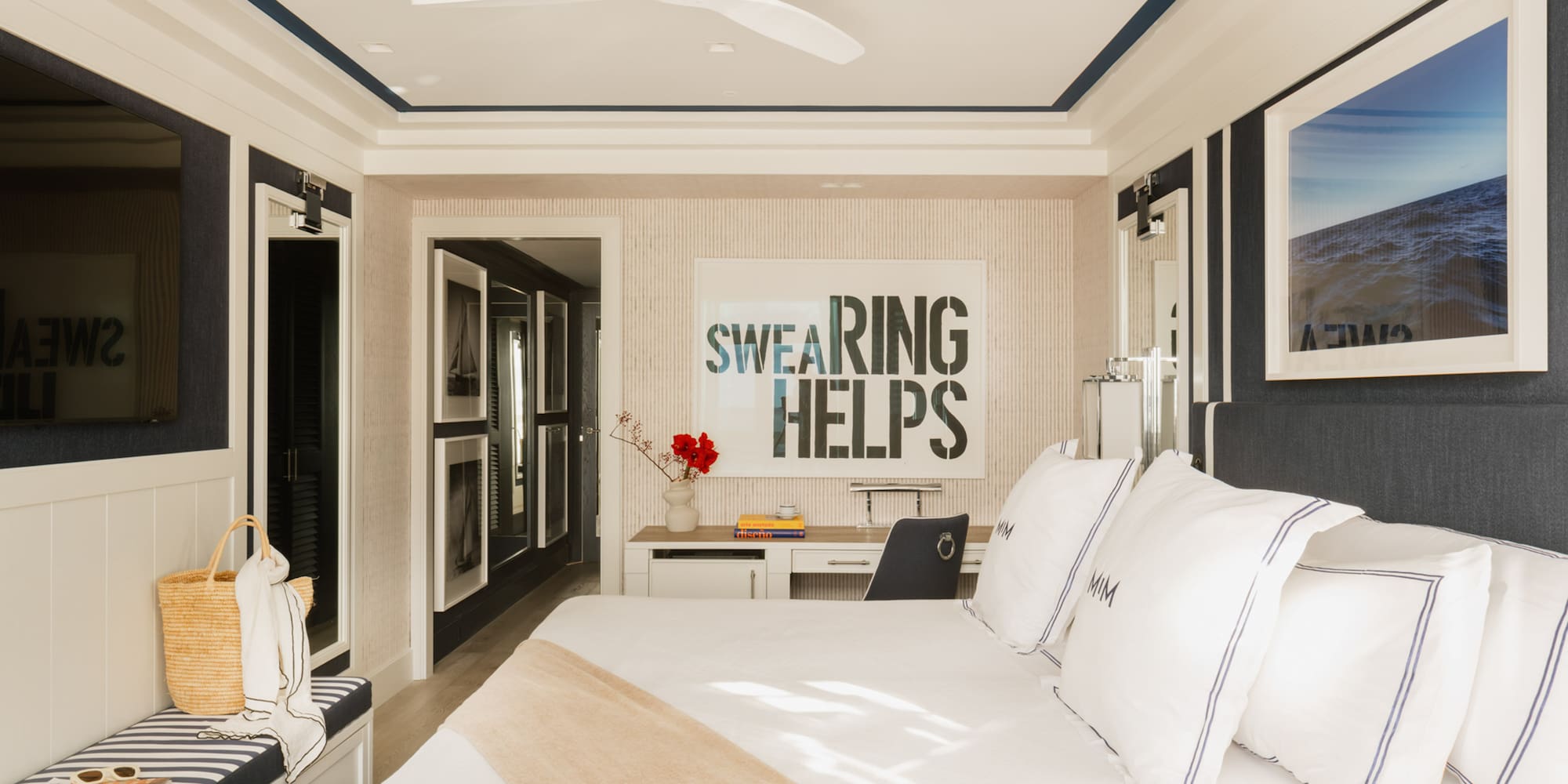 a bedroom with a bed and a fan