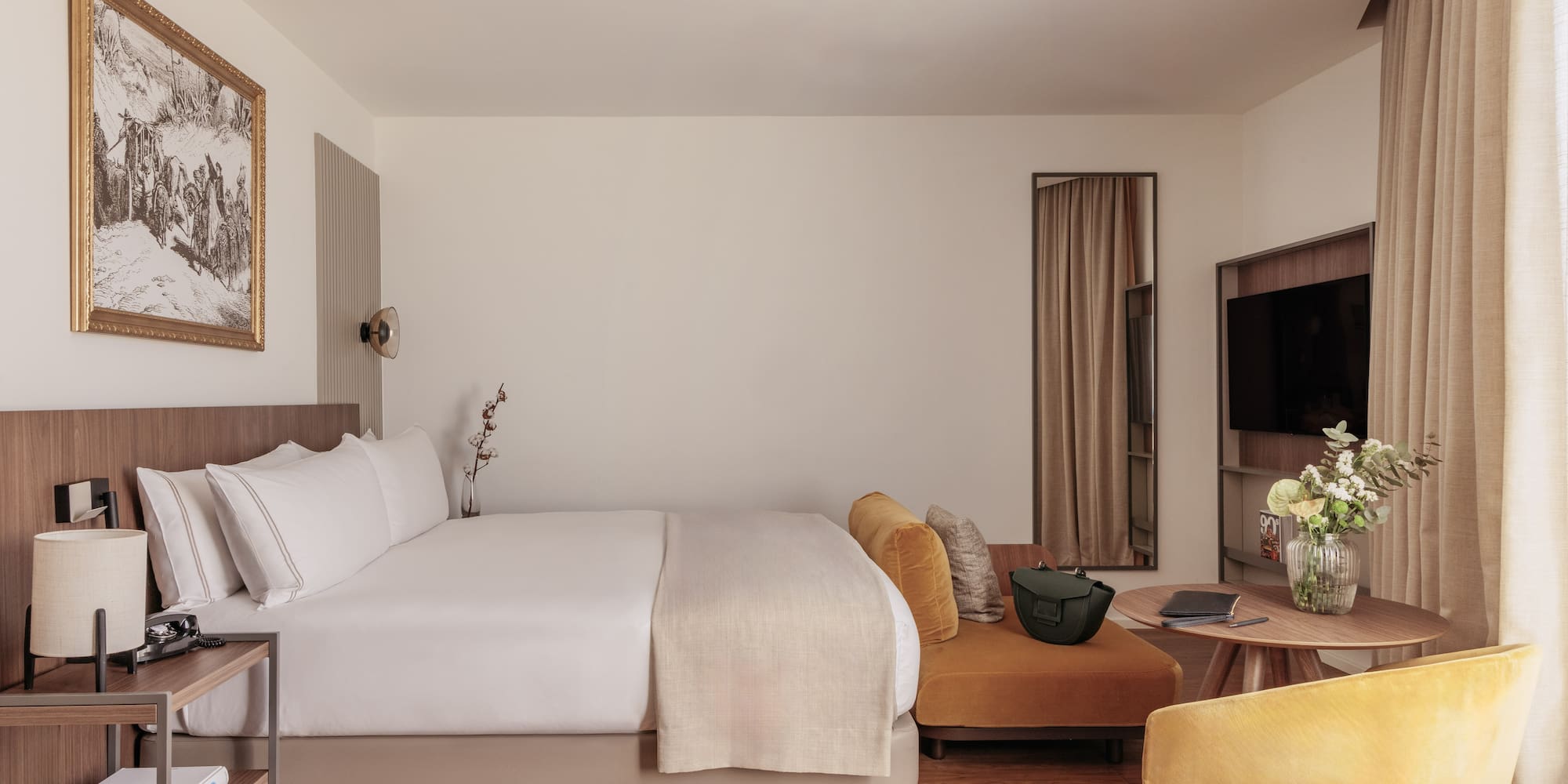 a room with a bed and a television