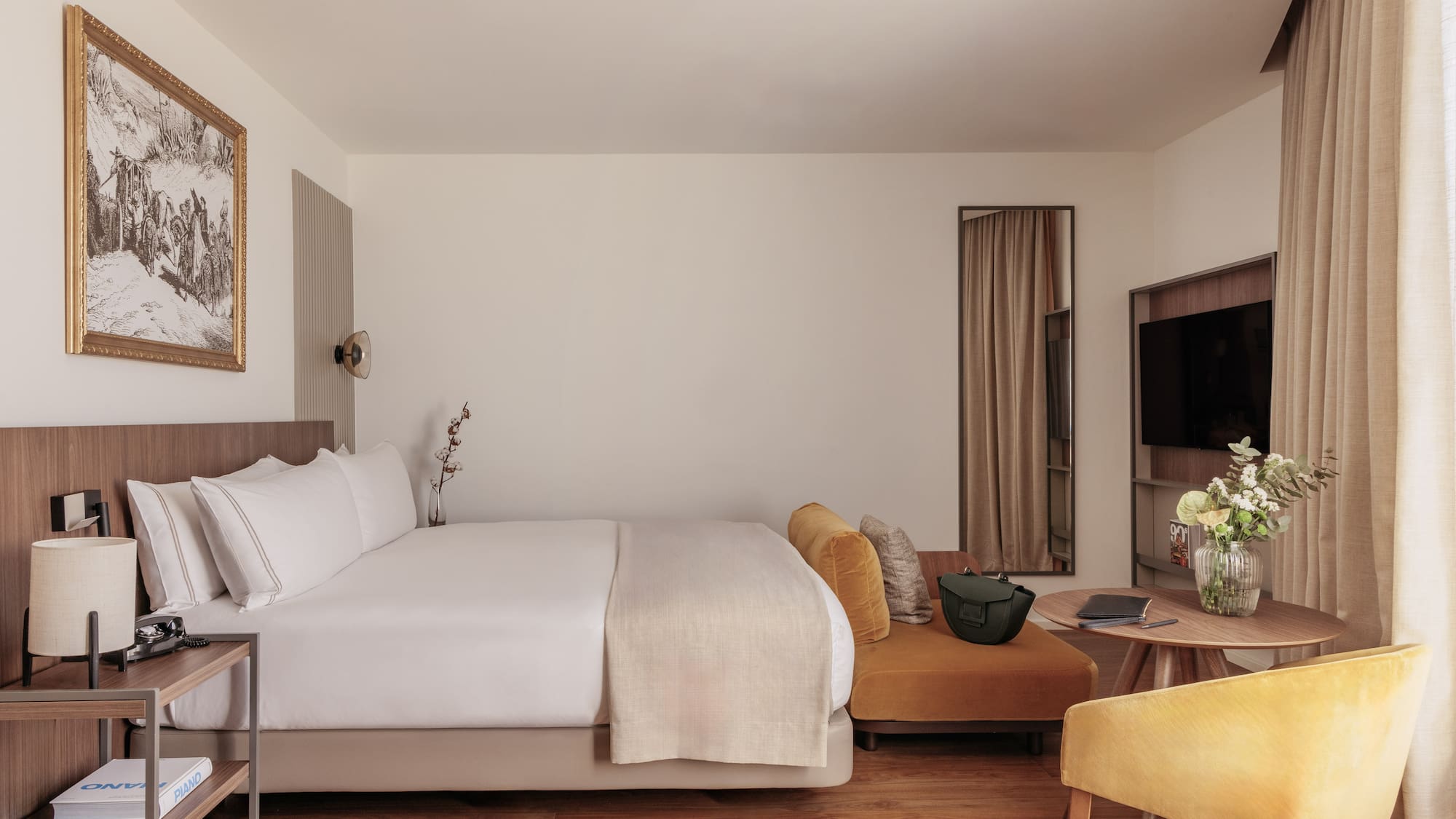 a room with a bed and a television