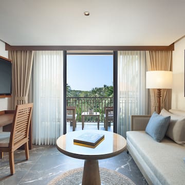 a living room with a television and a sofa