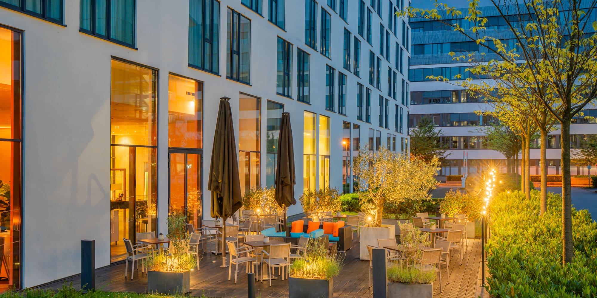 a building with a patio and chairs