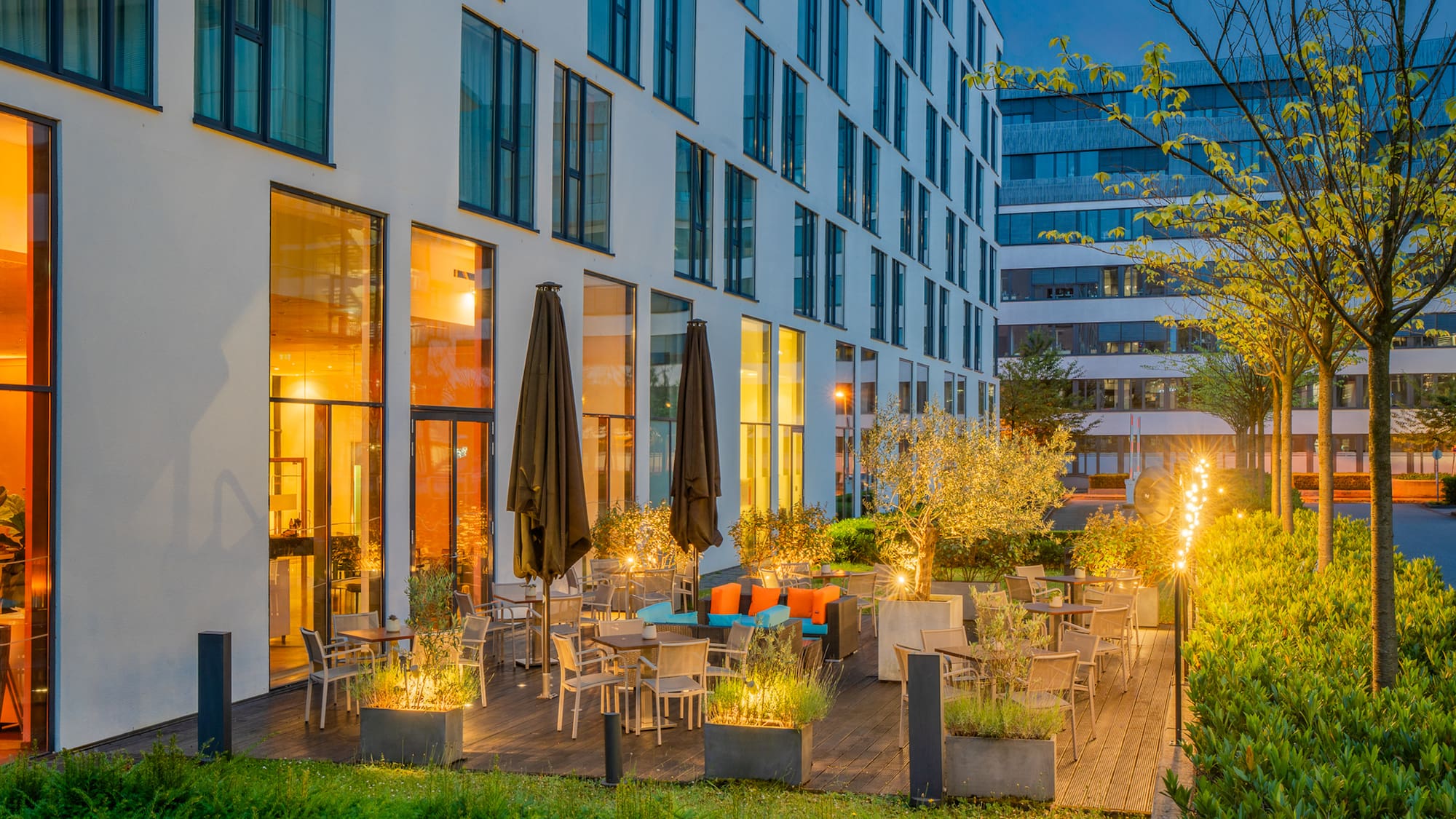 a building with a patio and chairs