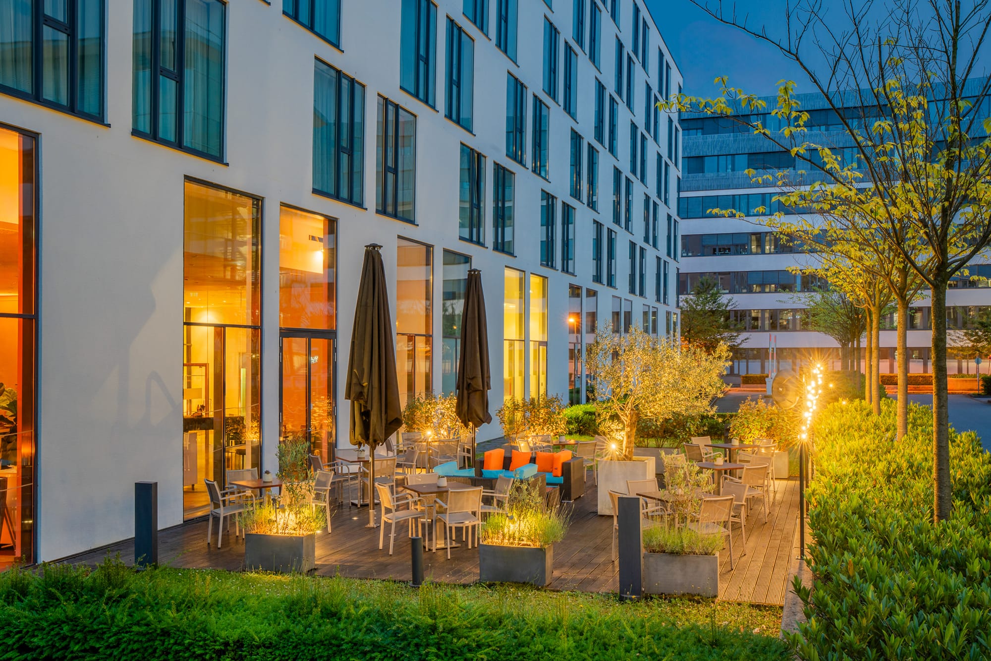 a building with a patio and chairs