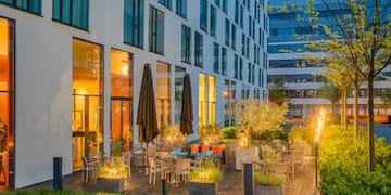a building with a patio and chairs
