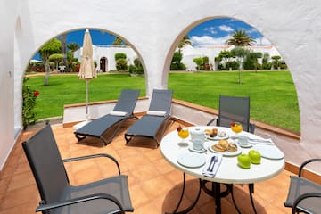 a table and chairs on a patio
