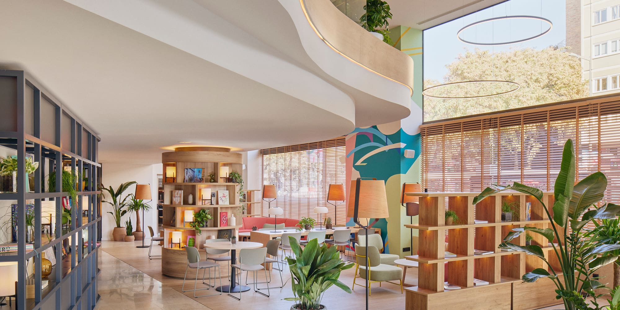 a room with a large window and a large staircase