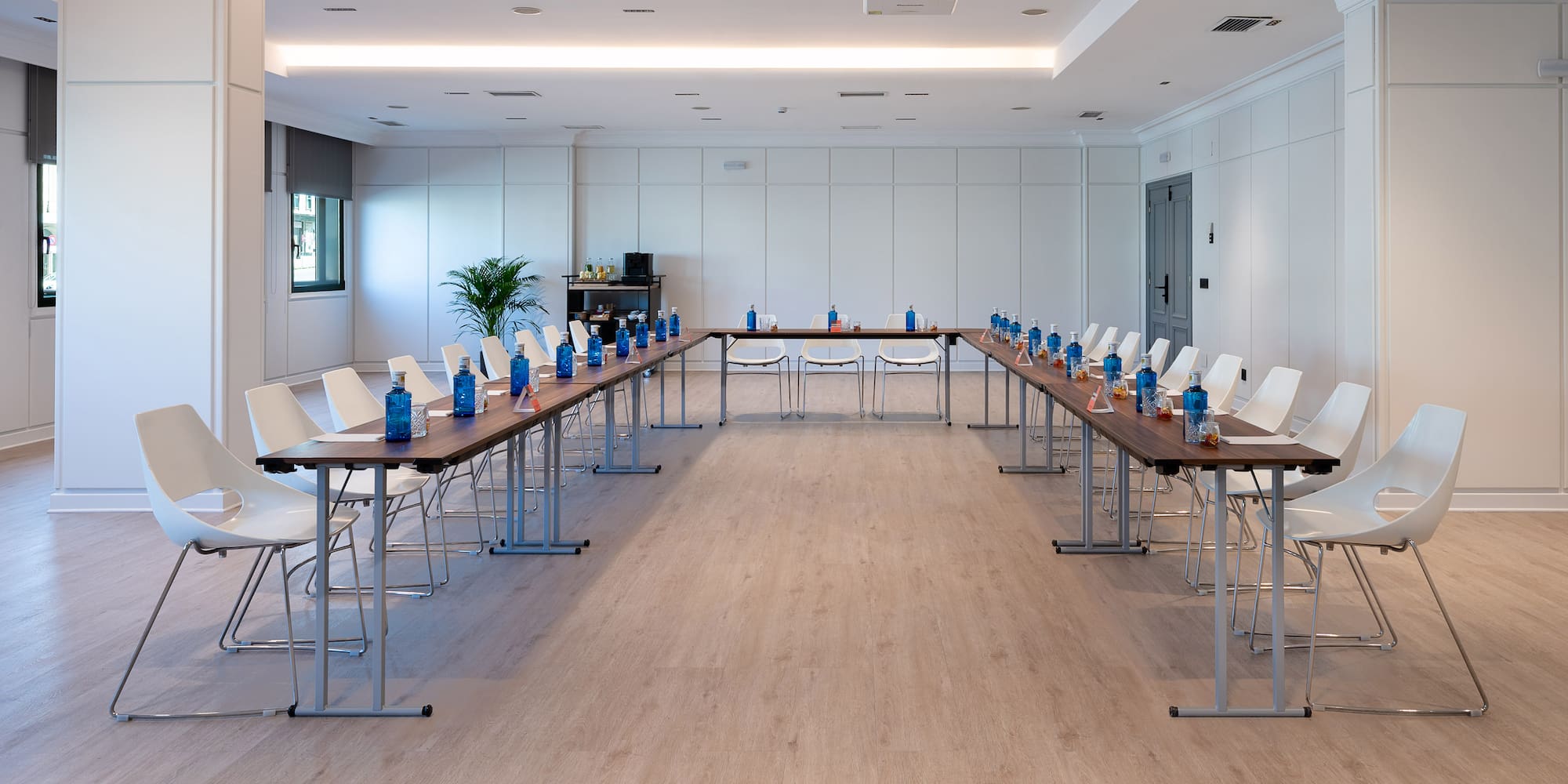 a room with long tables and chairs