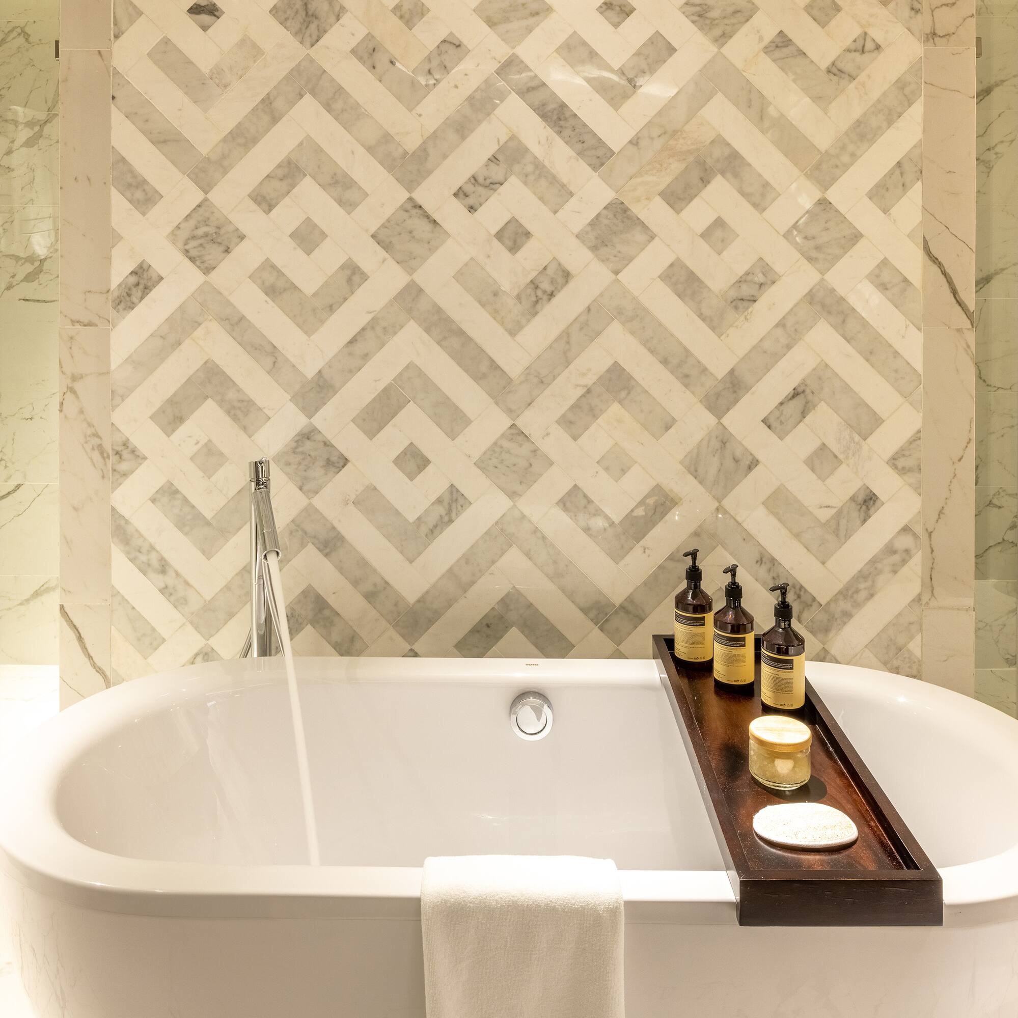 a bathtub with bottles on it