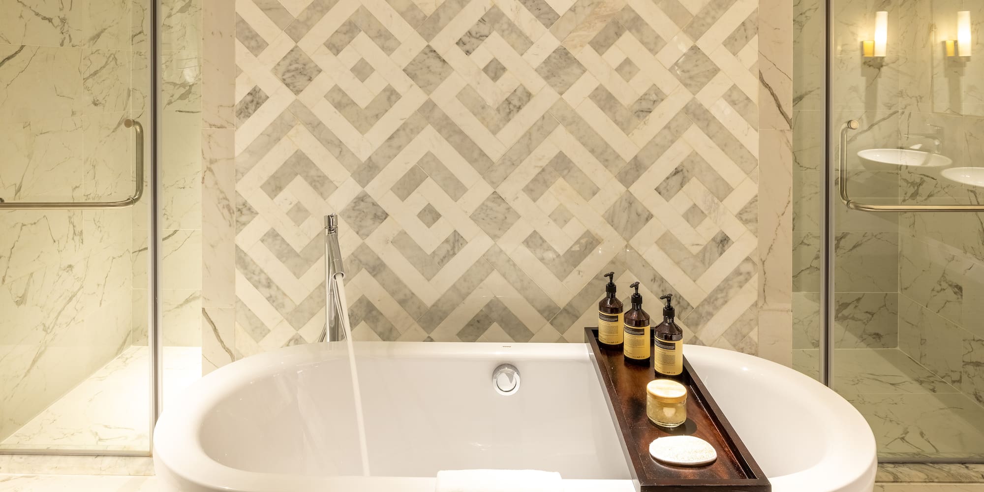 a bathtub with bottles on it