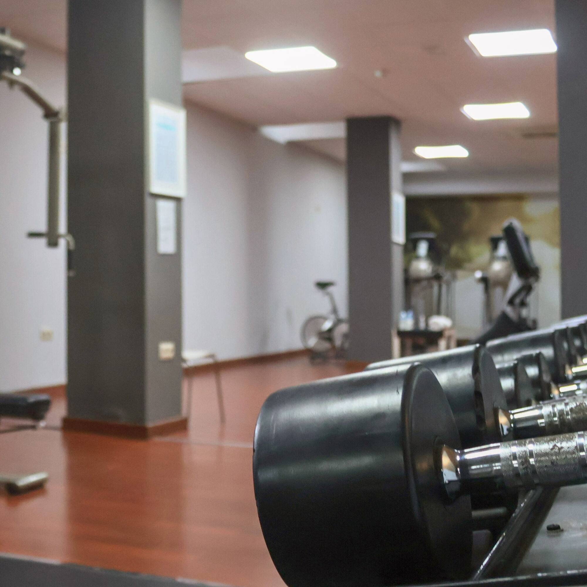 a gym with weights and exercise equipment