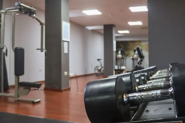 a gym with weights and exercise equipment