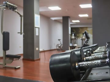 a gym with weights and exercise equipment