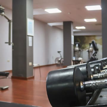 a gym with weights and exercise equipment