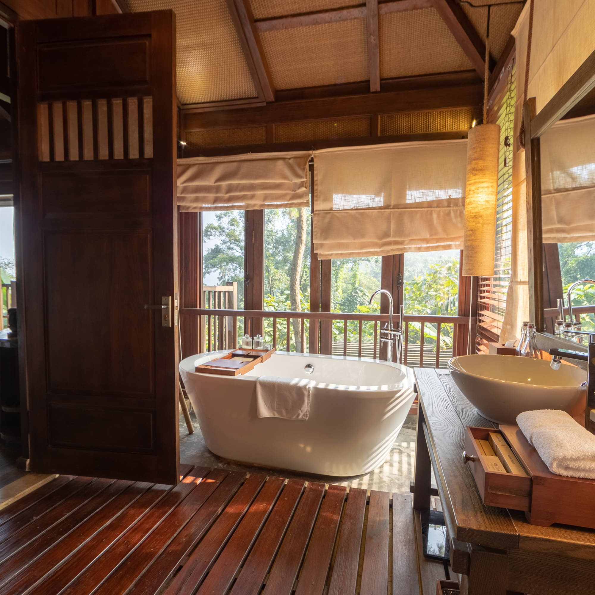 a bathroom with a tub and sink