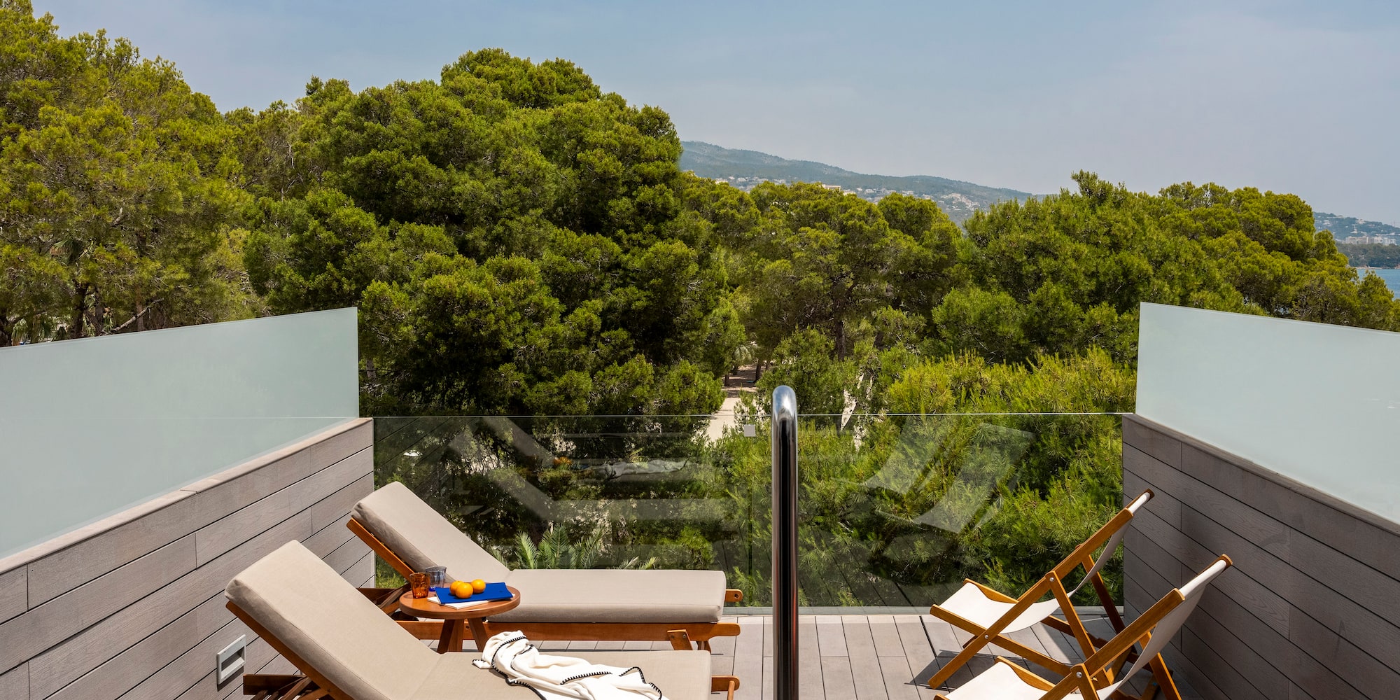 a deck with chairs and a table