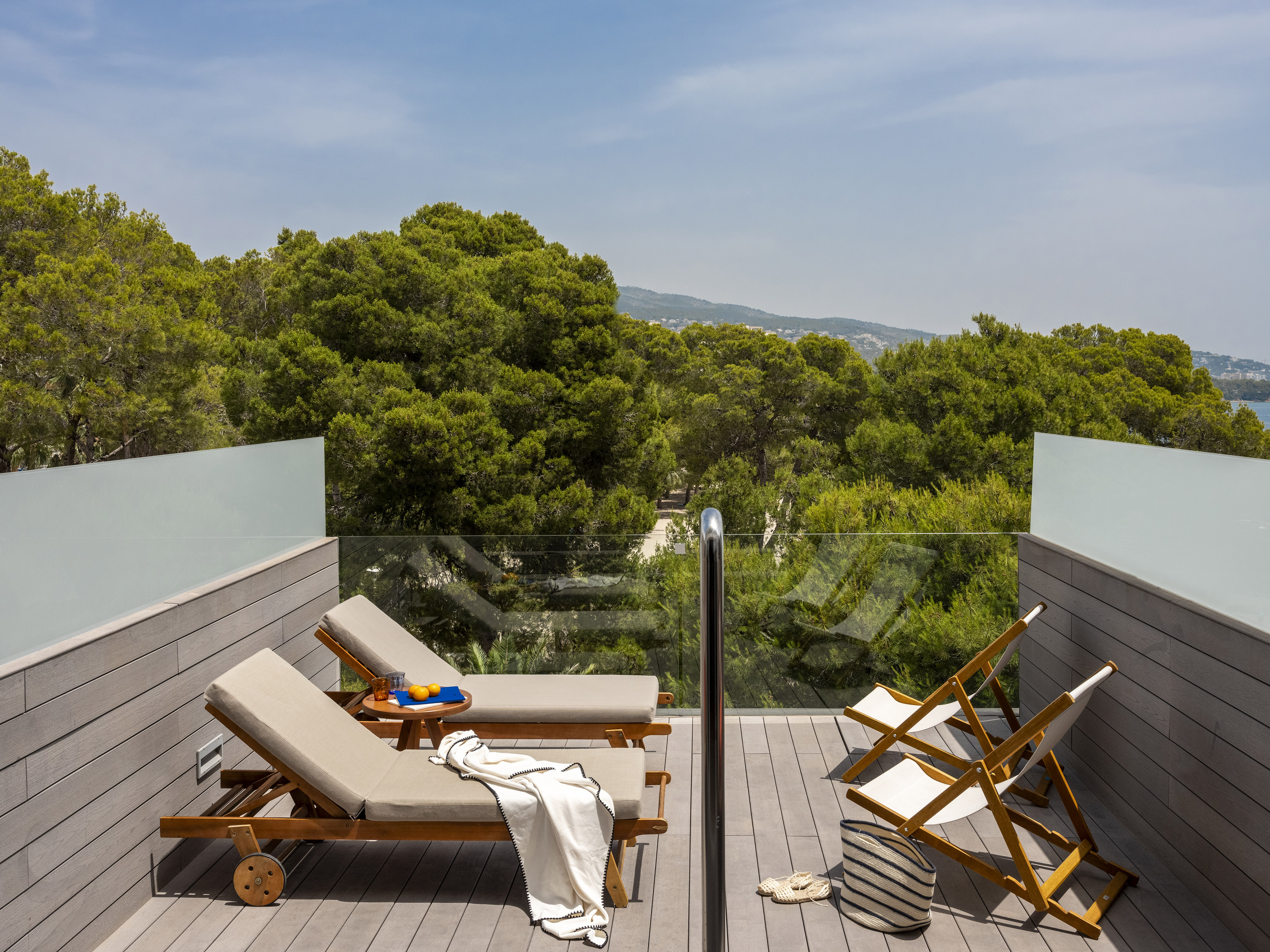 a deck with chairs and a table