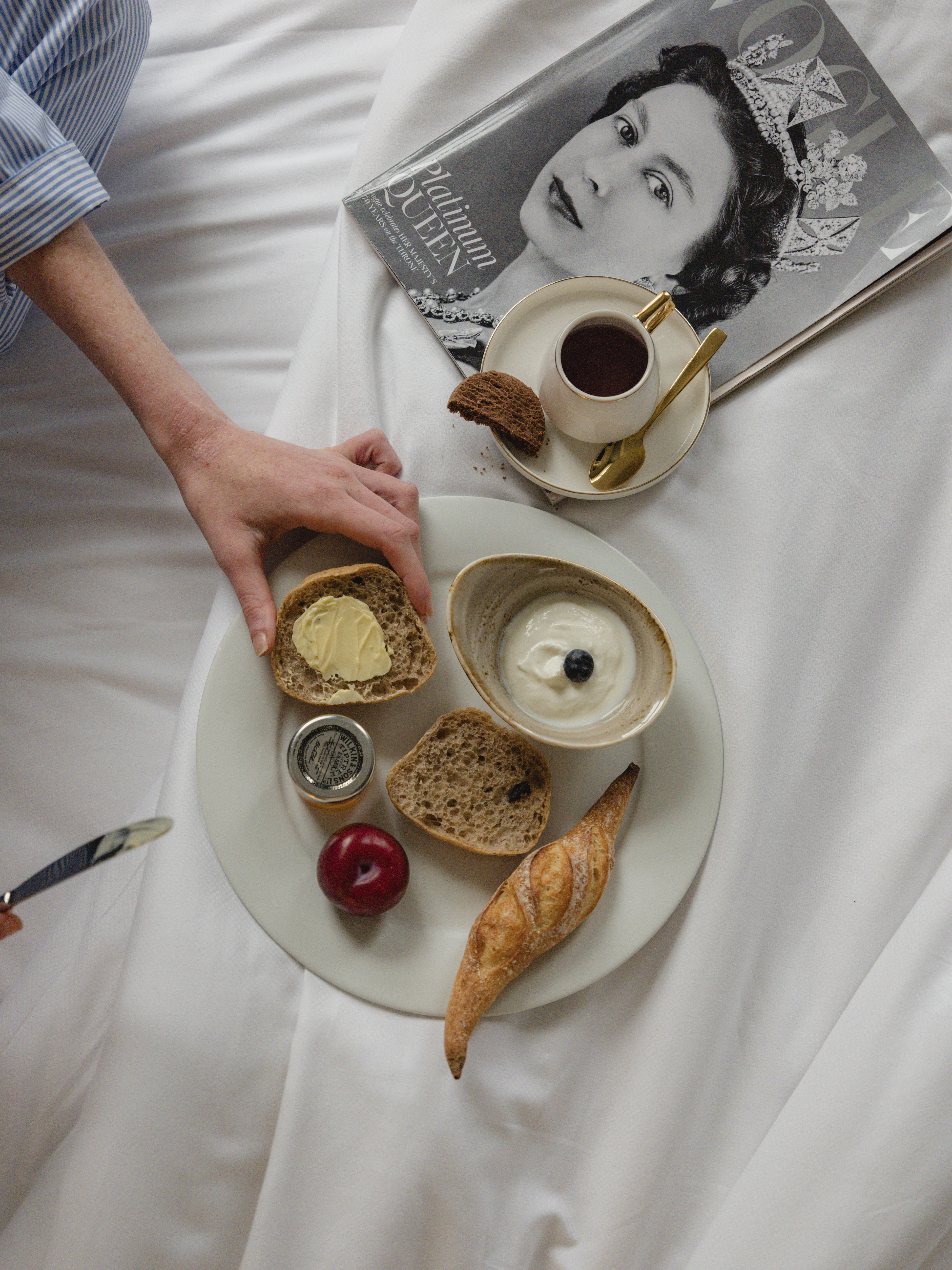 a plate of food on a bed