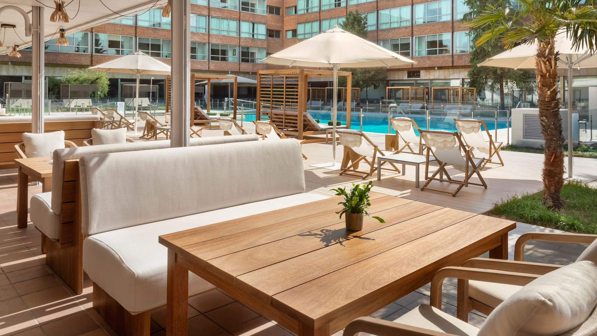 a pool with chairs and a table