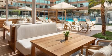 a pool with chairs and a table