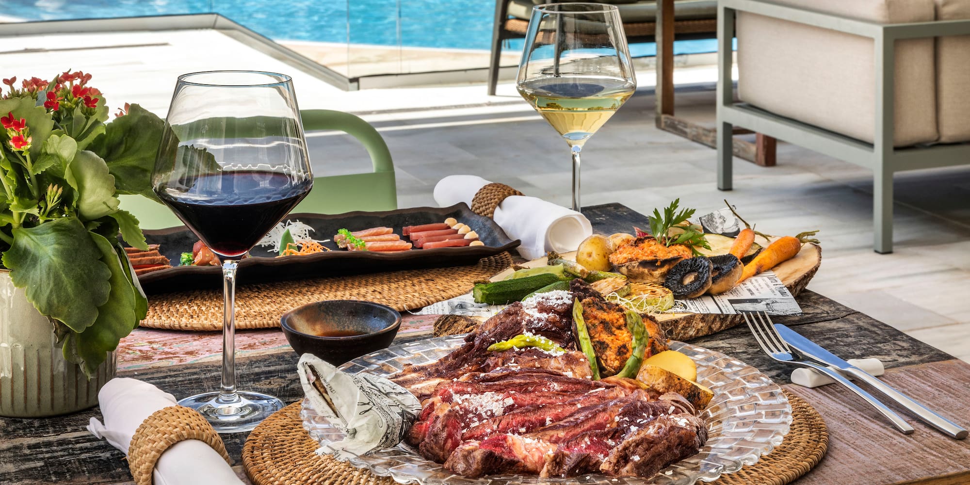 a table with food and wine glasses on it