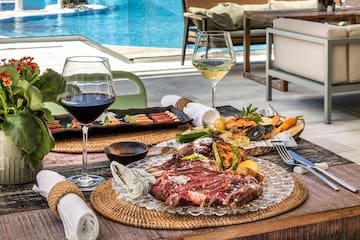 a table with food and wine glasses on it