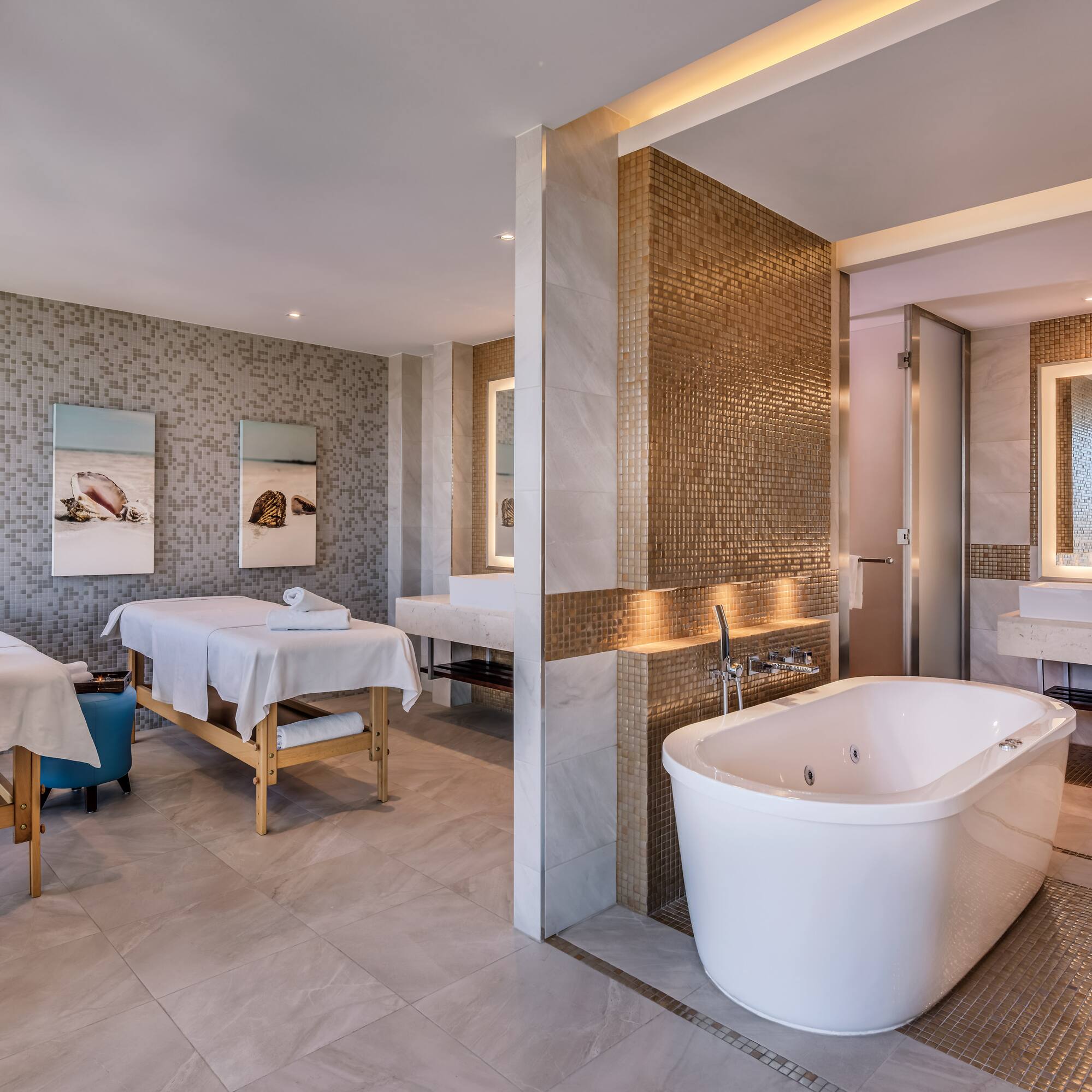 a room with a bathtub and sinks