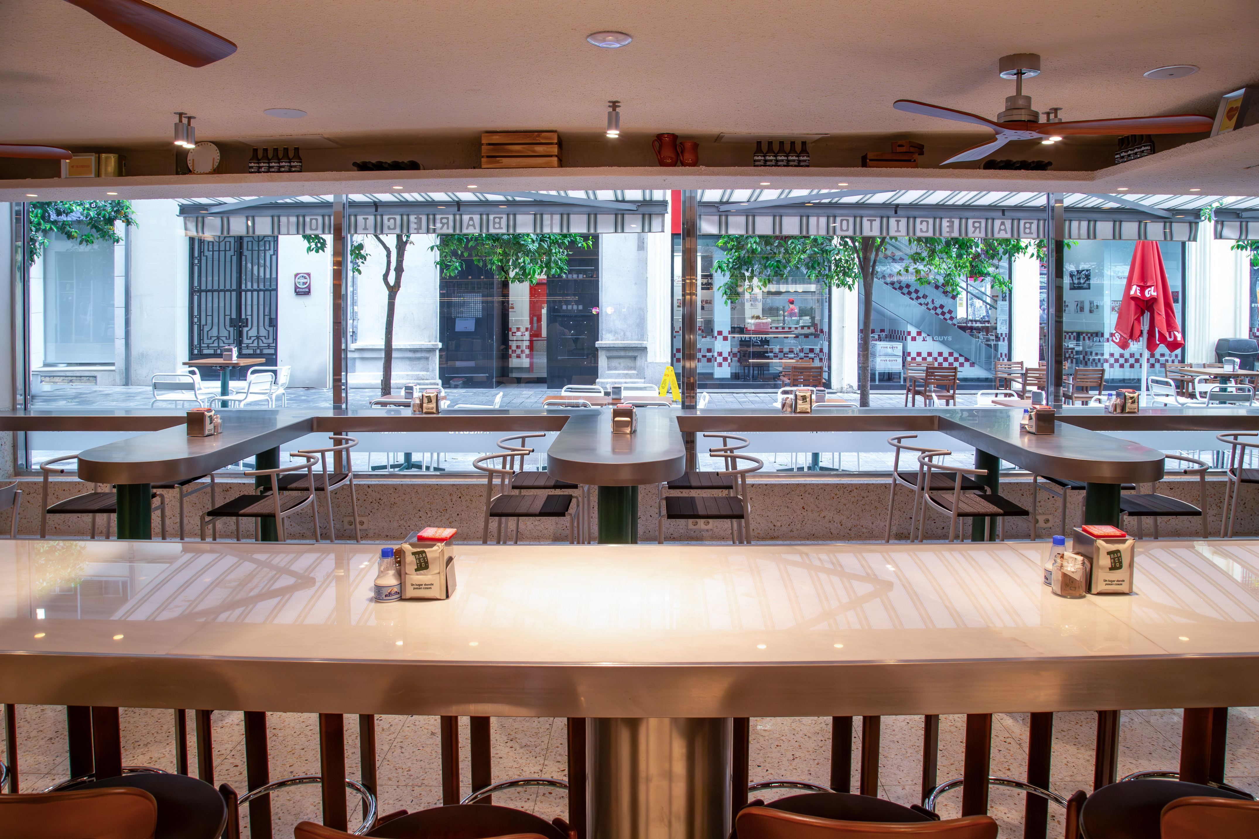 a large empty restaurant with tables and chairs