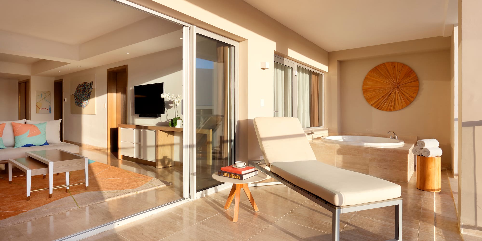 a lounge chair in a room with glass doors