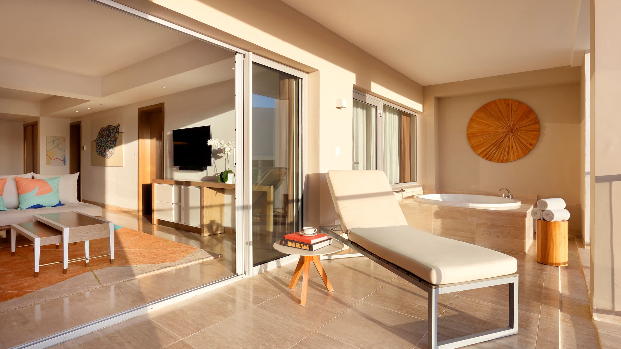 a lounge chair in a room with glass doors