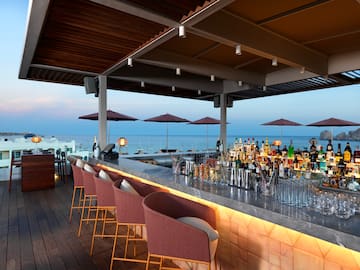 a bar with chairs and umbrellas