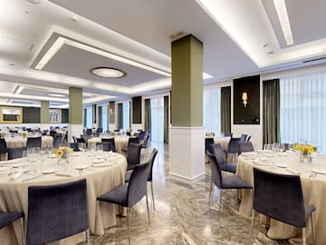 a room with tables and chairs