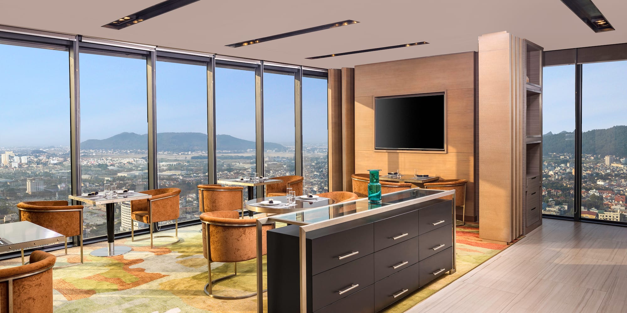 a room with a large window and a city view