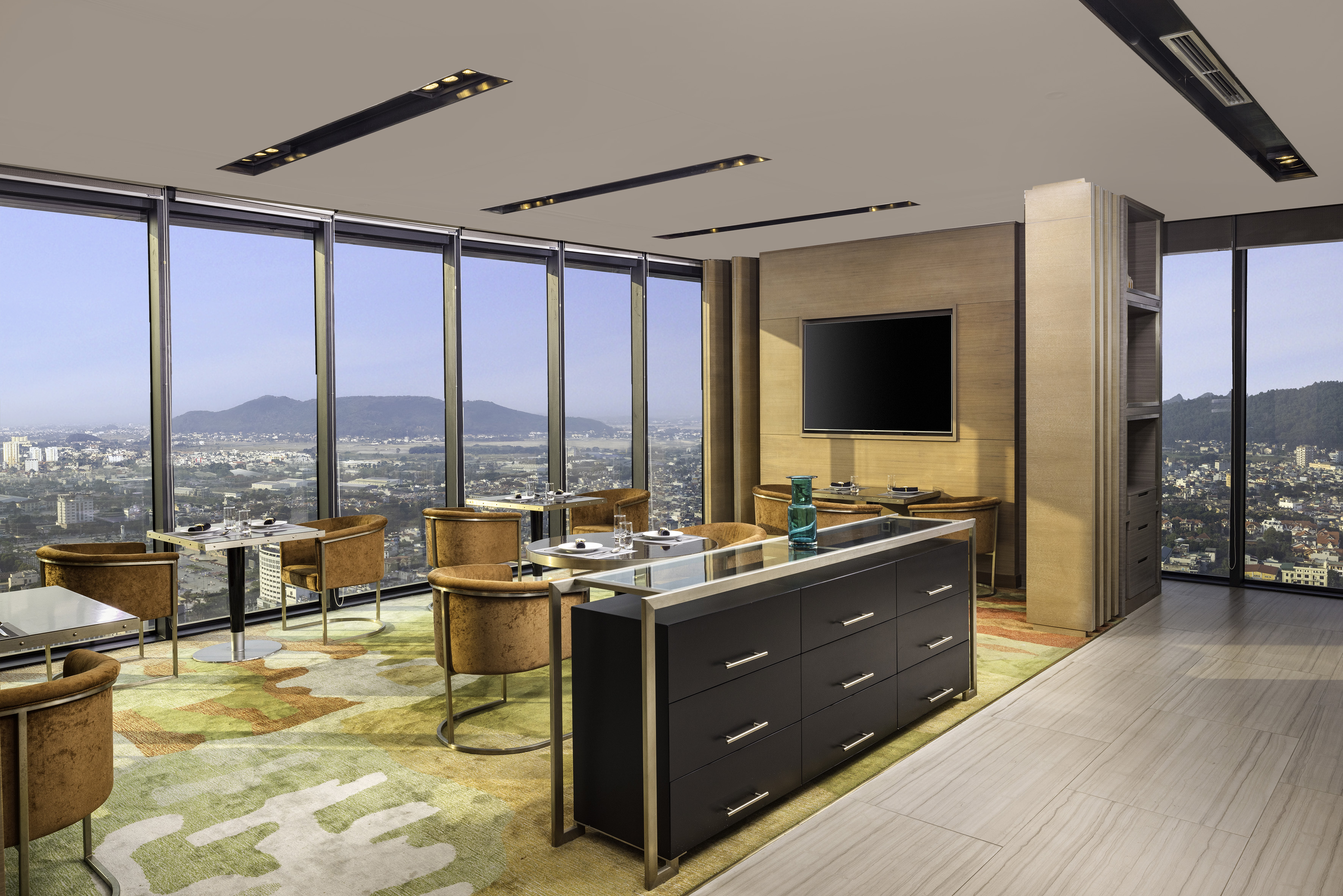 a room with a large window and a city view