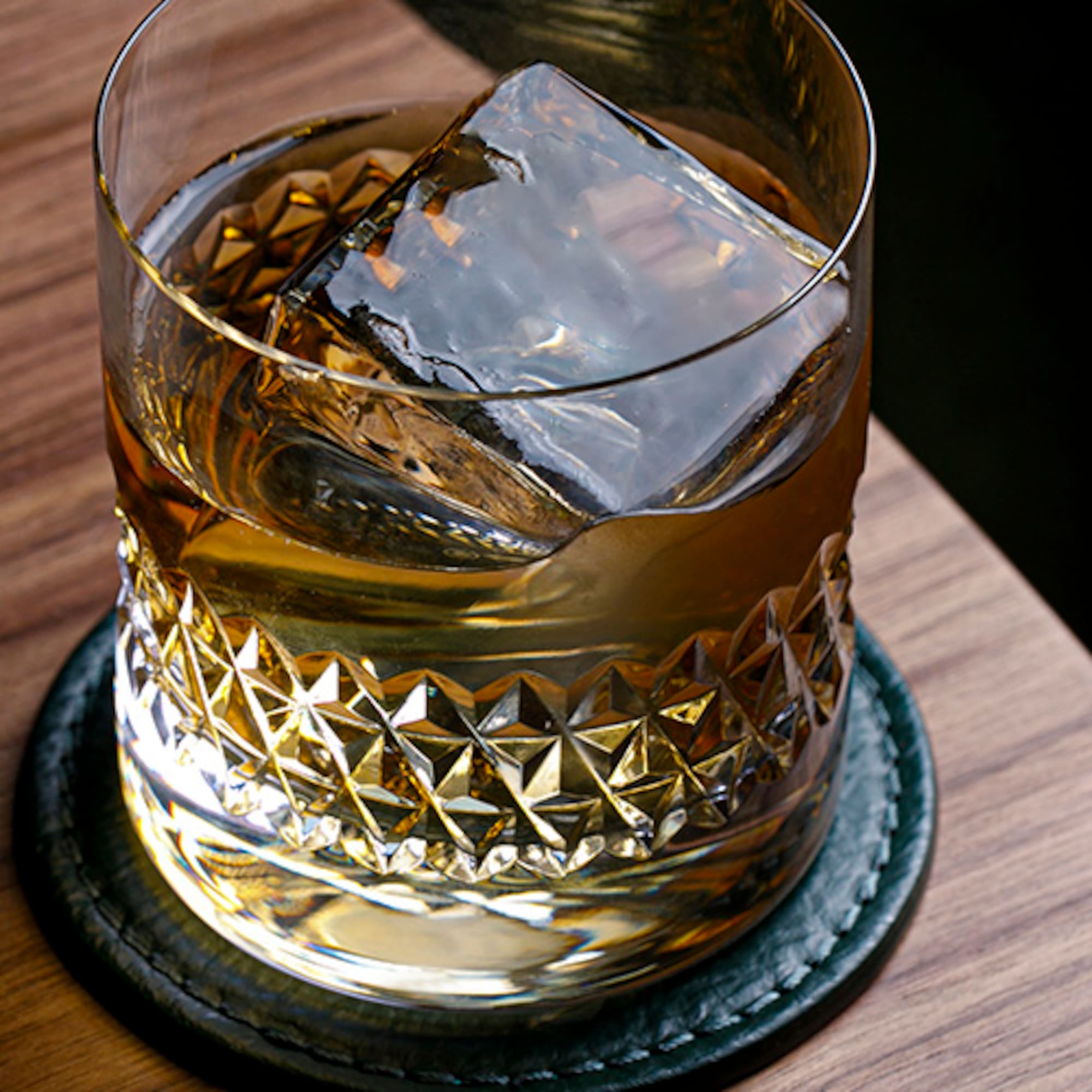 a glass with a drink and ice cubes