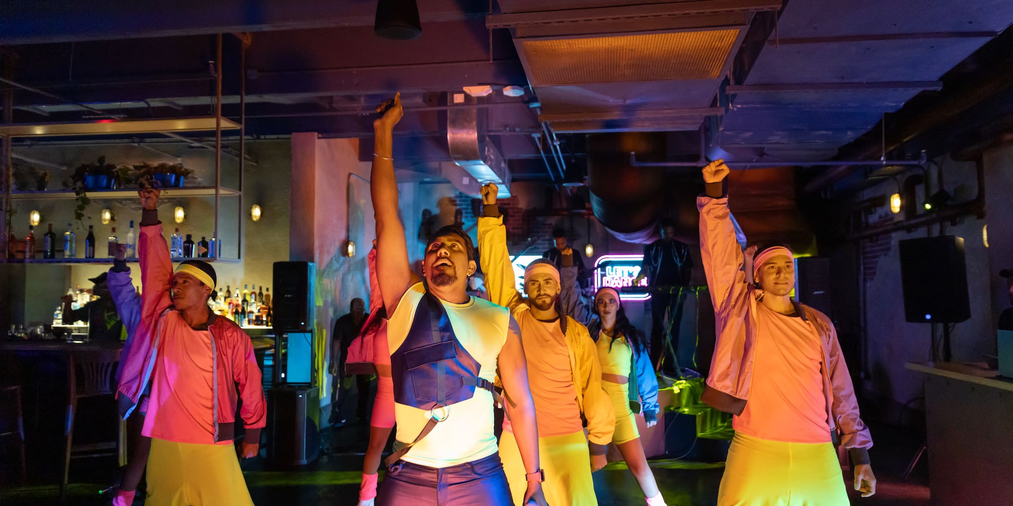 a group of people dancing in a club