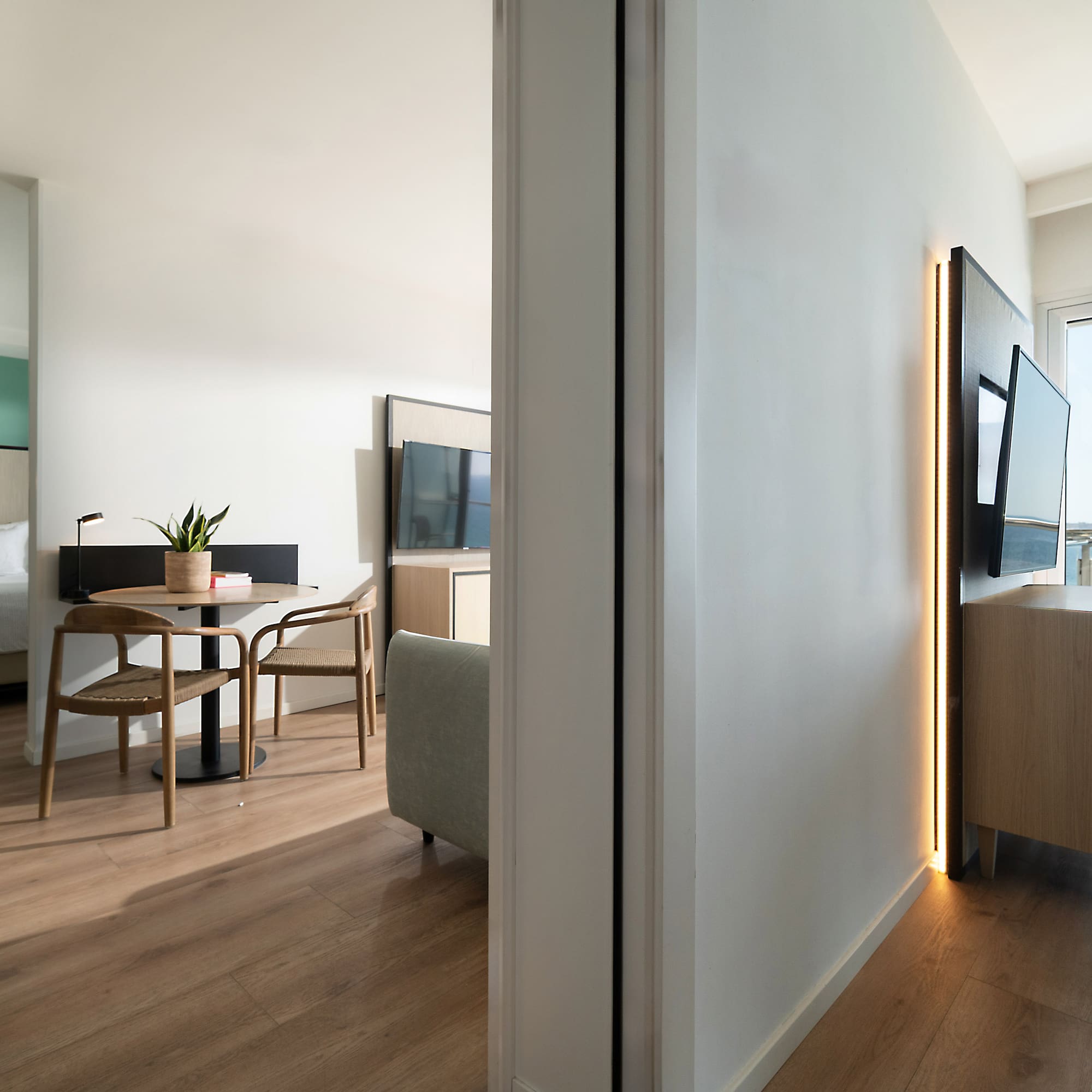 a room with a tv and a table