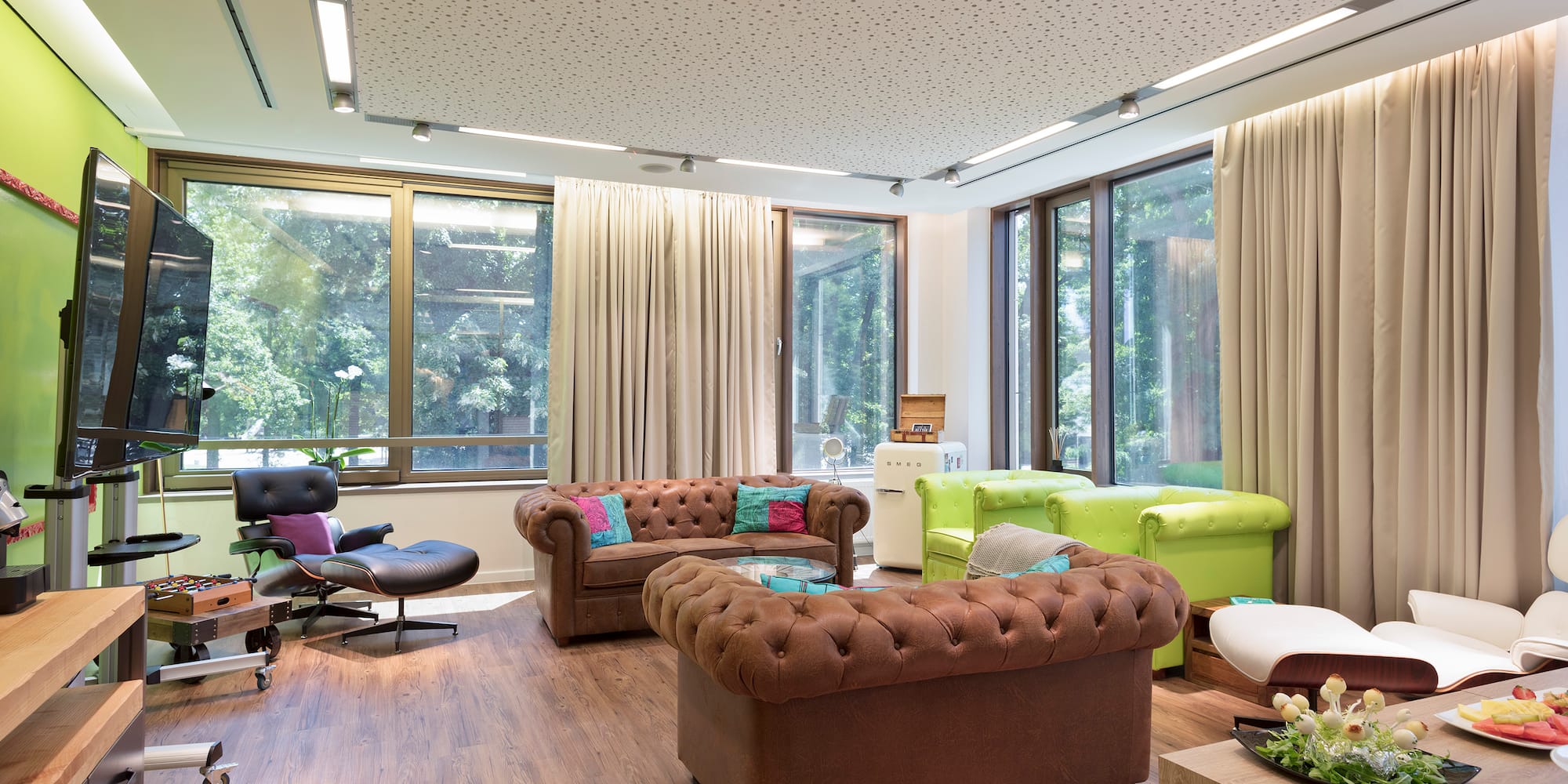 a room with couches and chairs