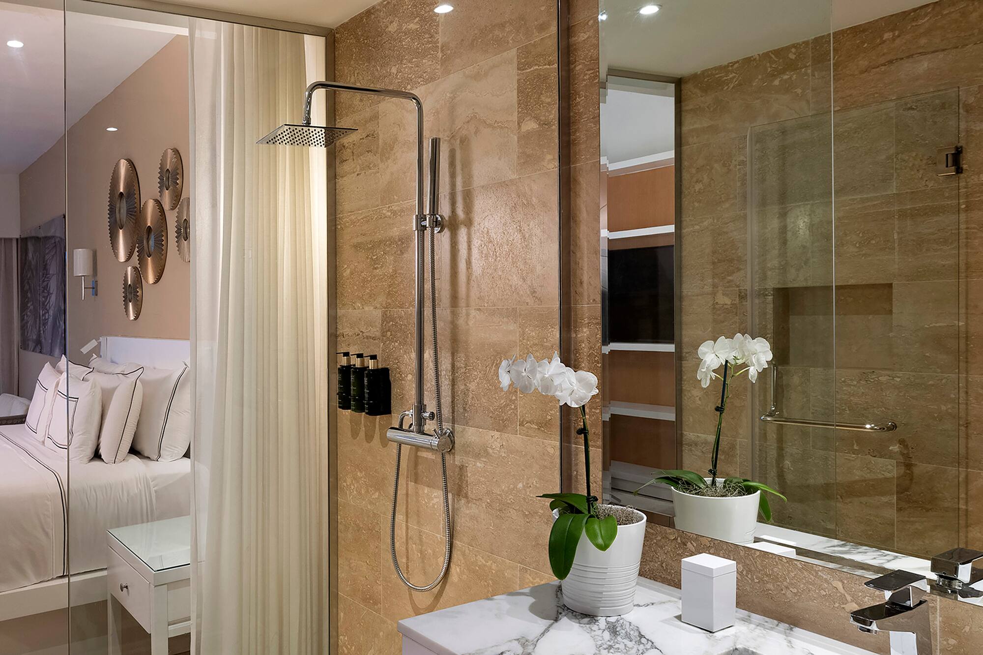 a bathroom with a shower and sink