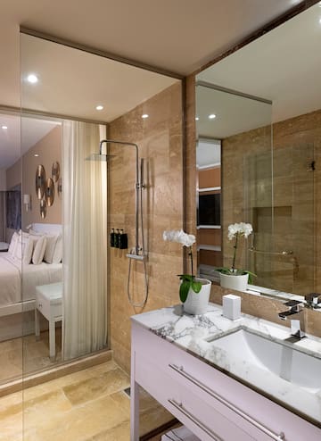 a bathroom with a shower and sink
