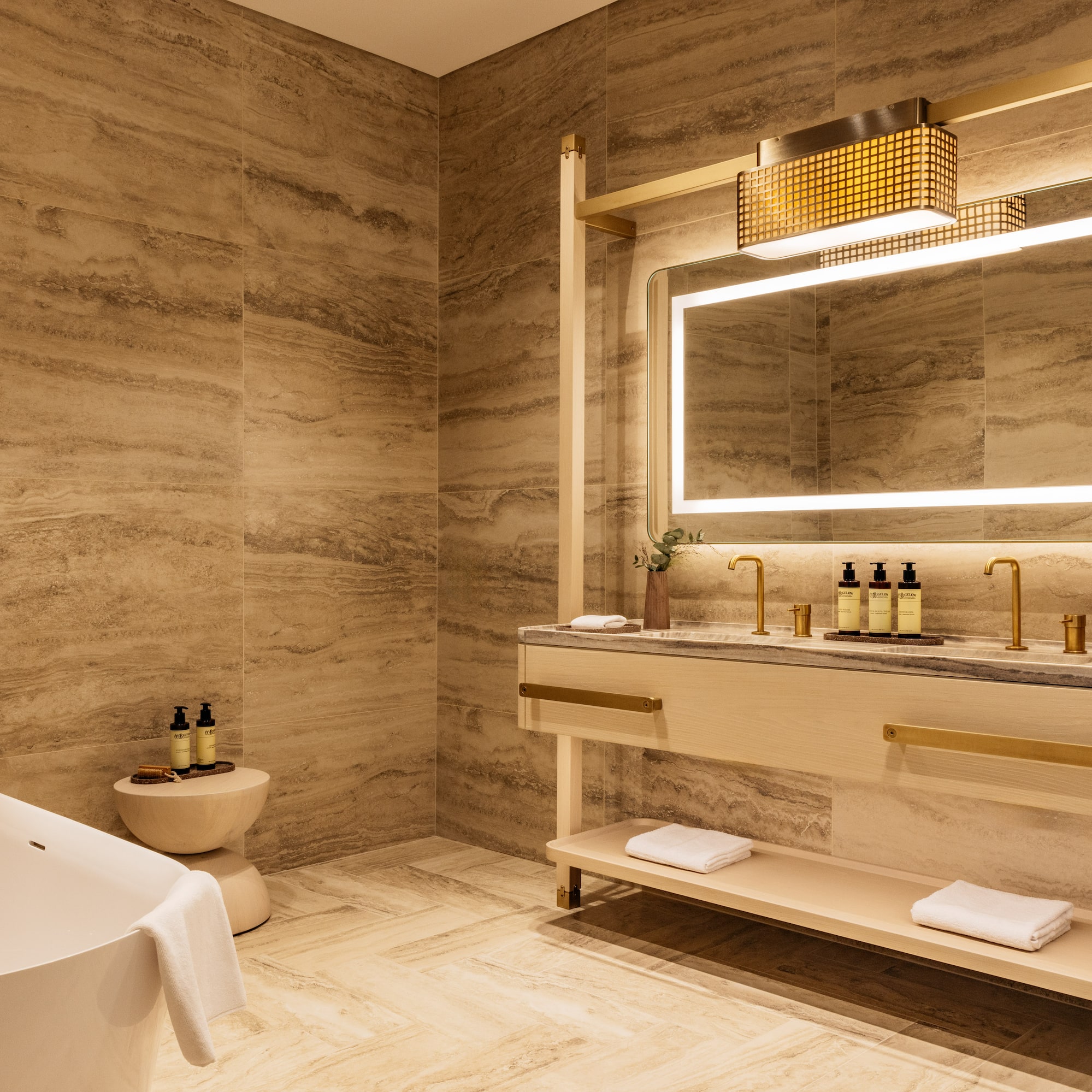 a bathroom with a tub and sink