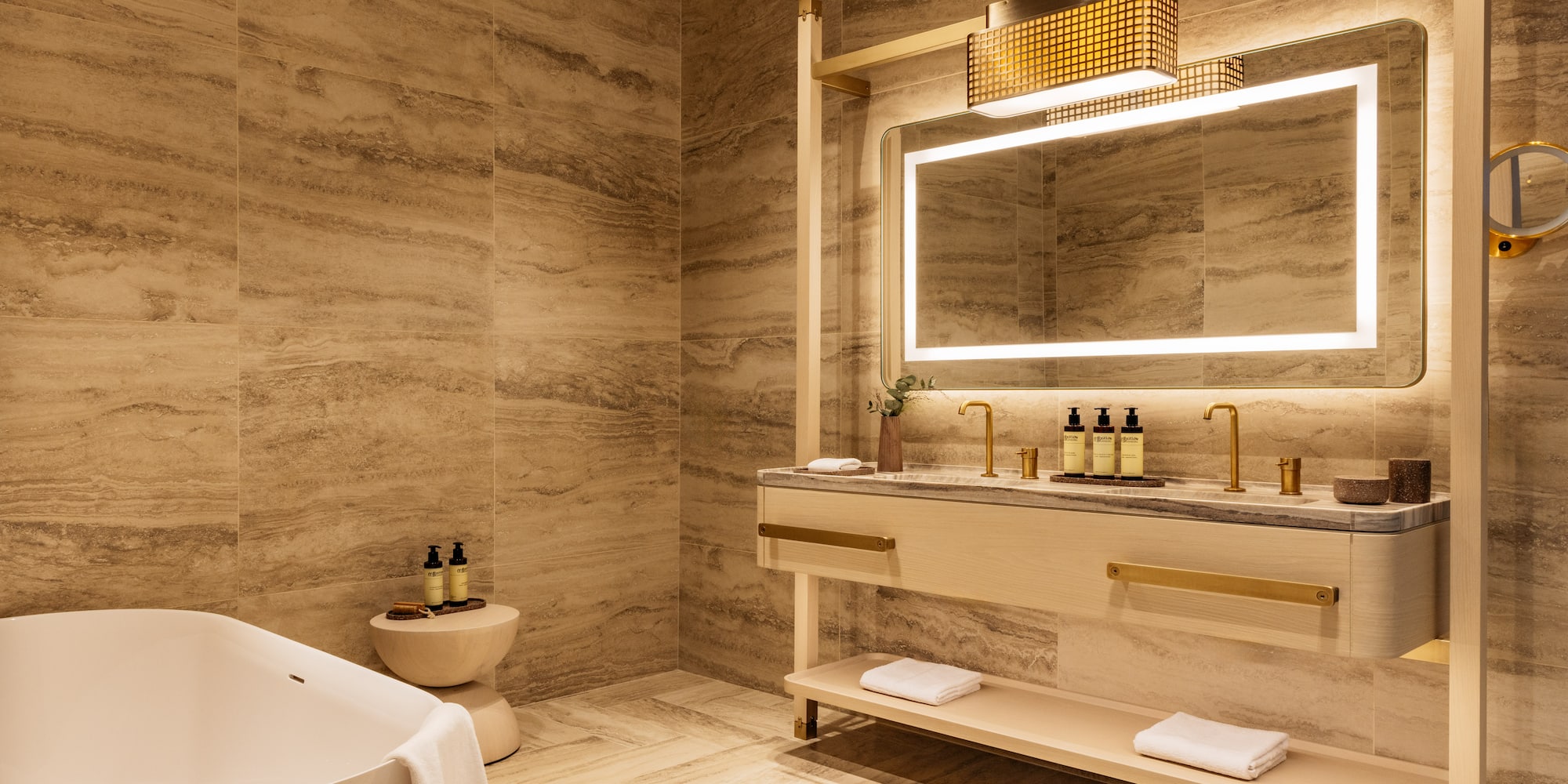 a bathroom with a tub and sink