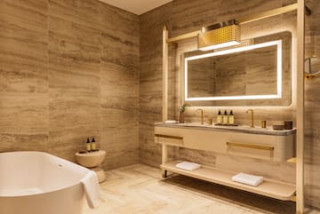 a bathroom with a tub and sink