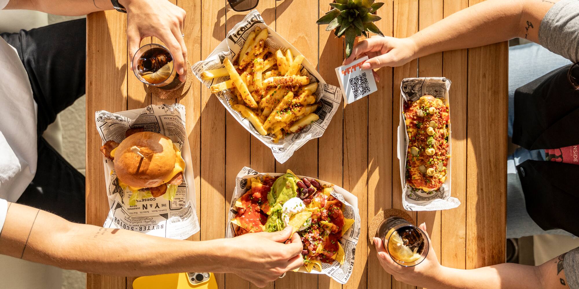 a group of people eating food on a table