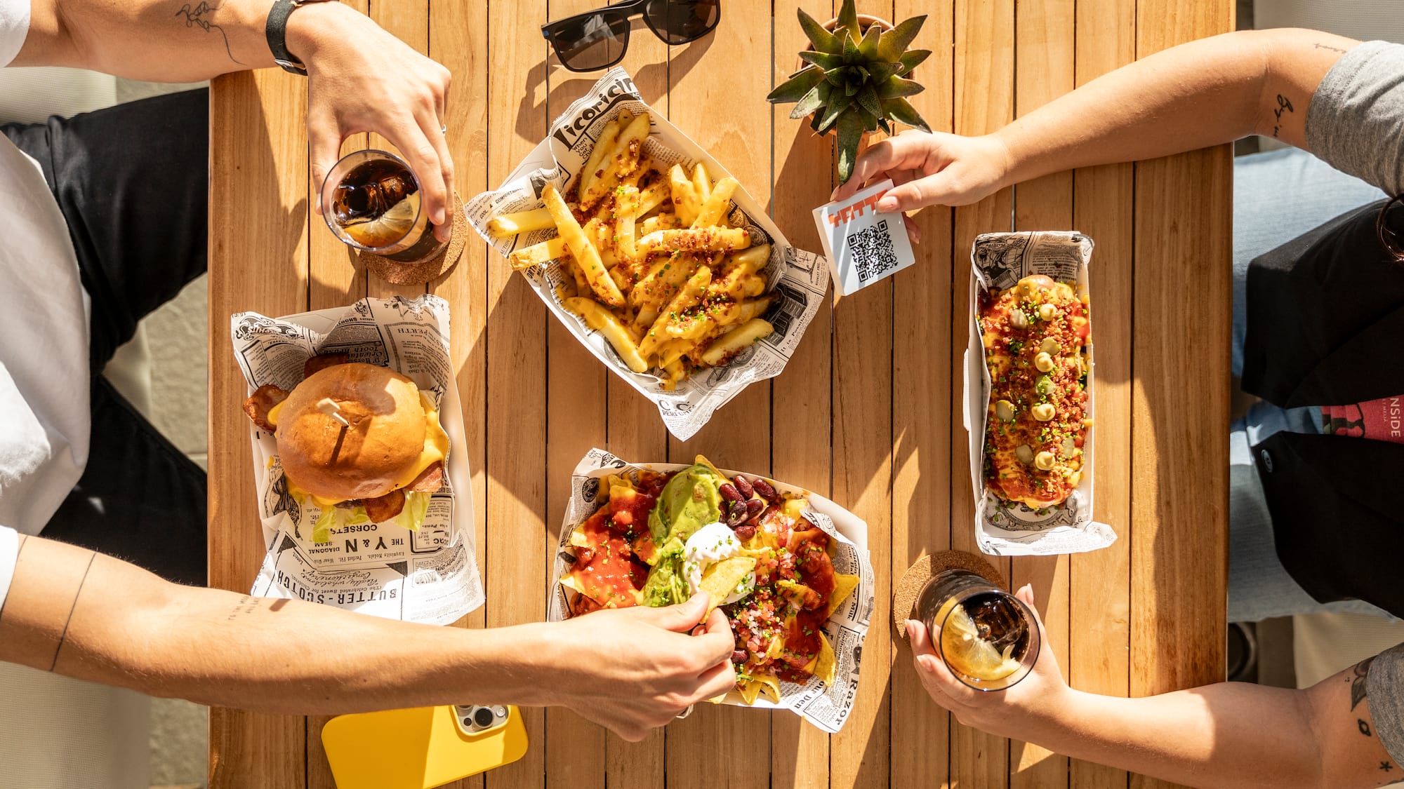 a group of people eating food on a table